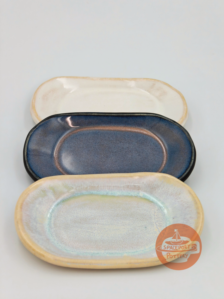 Home Ceramic Orbit Tray made of stoneware in three colors.