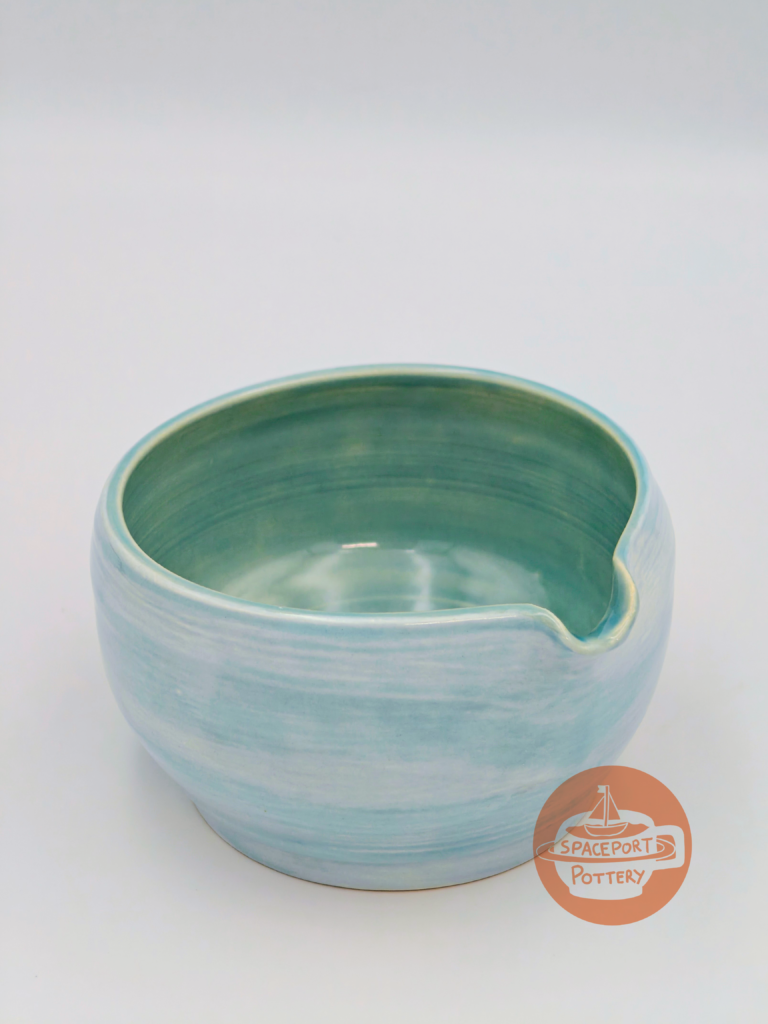 Home Wheel-thrown ceramic Wave Matcha Bowl in a lagoon-blue glaze.